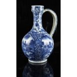 A Japanese blue & white ewer, late 17th / early 18th century, damages & restorations, 11ins. (