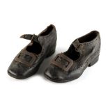 Property of a gentleman - a pair of Victorian child's black leather brogue shoes, with steel buckles