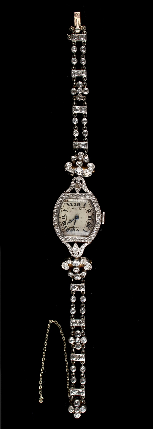 An early 20th century Belle Epoque Cartier platinum 18ct gold & diamond cocktail watch, on diamond