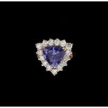 A 9ct yellow gold tanzanite & diamond cluster ring, the triangular cut tanzanite approximately 2.