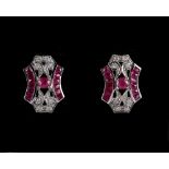 A pair of Art Deco style 9ct white gold ruby & diamond earrings, each with a central round cut