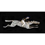 A diamond & enamel horse & jockey brooch, the estimated total diamond weight 1.65 carats, 1.