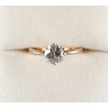 Property of a lady - a yellow gold diamond solitaire ring, the brilliant cut diamond approximately