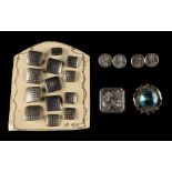 A set of thirteen niello decorated square buttons, early 20th century; together with a pair of