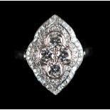 An 18ct white gold diamond cluster ring, with four central diamonds in a quatrefoil millegrain