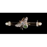 An unmarked yellow gold multi gem set fly brooch, set with rose cut diamonds, with pearl ends,