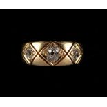 Property of a lady - an 18ct yellow gold diamond three stone gipsy ring, the estimated total diamond