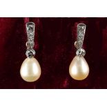 A good pair of natural saltwater pearl & diamond pendant drop earrings, the cream coloured pear