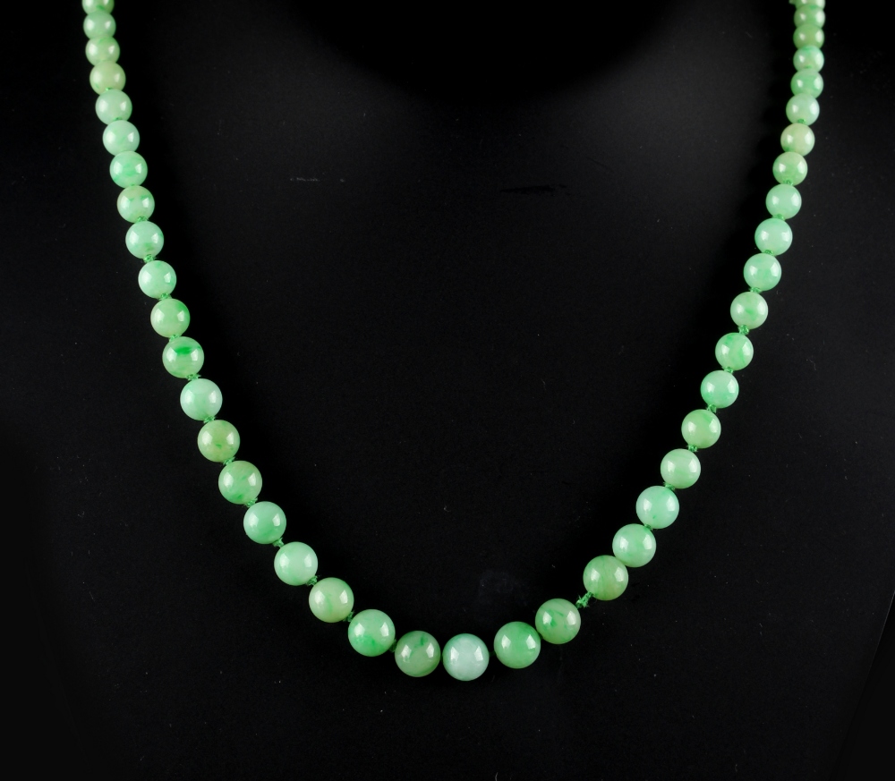 A single strand graduated jadeite bead necklace, the eighty individually knotted jadeite beads