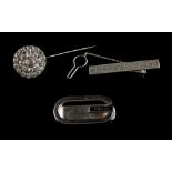 Property of a gentleman - a Turkish Urart 925 silver tie clip; together with a Gucci money clip; and