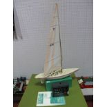 A Plastic Hulled Pond Yacht, approximately 50cms long, with a beam of 12cms at widest point, 67cms