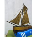 A Mid XX Century Wooden Hulled Model of a Sailing Gaffer, length 45cms with a beam of