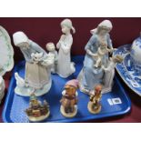 Three Lladro Models, including 'Bless The Child' (numbered 5996) 'Girl with Ducks' and 'Little