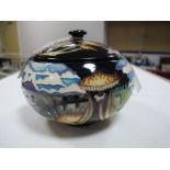 A Moorcroft Pottery Circular Lidded Pot, decorated with the Trial 'Bredon Hill' design from the Vale