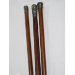 Two XIX Century Malacca Type Swagger Sticks, with hallmarked silver handles, another similar. (3)