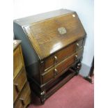 XX Century Oak Bureau, with a fall front, fitted interior, over two long drawers on cup cover