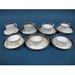 Two Worcester Porcelain Tea Bowls and Saucers, of fluted form, decorated in dark blue and gilt