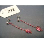 A Pair of Modern Pink Sapphire Bead Drop Earrings, on post fittings stamped "14k".