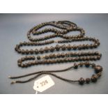 Four XIX Century Black Carved Bead Necklaces. (4)