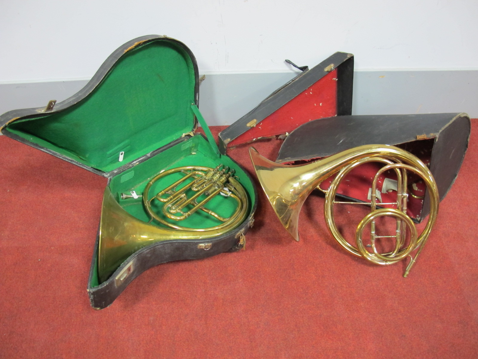 An Early XX Century Brass Natural Horn, inscribed "Orsi, Milano", fitted case; A Brass Three Valve