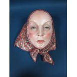 An Italian Lenci Pottery Art Deco Wall Mask, by Helen Konig Scavini, modelled as a young woman