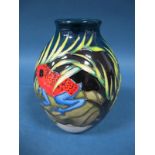 A Moorcroft Pottery Vase, tubelined and decorated with the 'Trial' Darting Frogs design from the