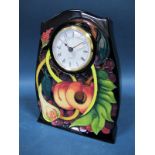 A Moorcroft Pottery Clock, tubelined and decorated with the Queens Choice design by Emma Bossons,