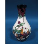 A Moorcroft Pottery Vase, tubelined and decorated with the Honeysuckle Haven design by Rachel