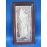 An Arts & Crafts Sewn Silk Picture, depicting a medieval woman holding a vase, 60.5 x 32cms overall.