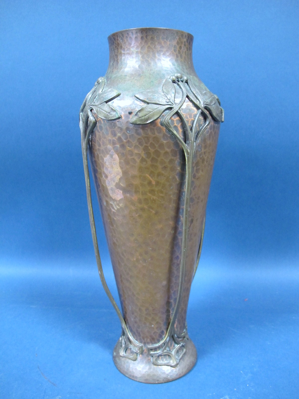 An Early XX Century W.M.F. Planished Copper Baluster Vase, decorated with applied plant tendrils