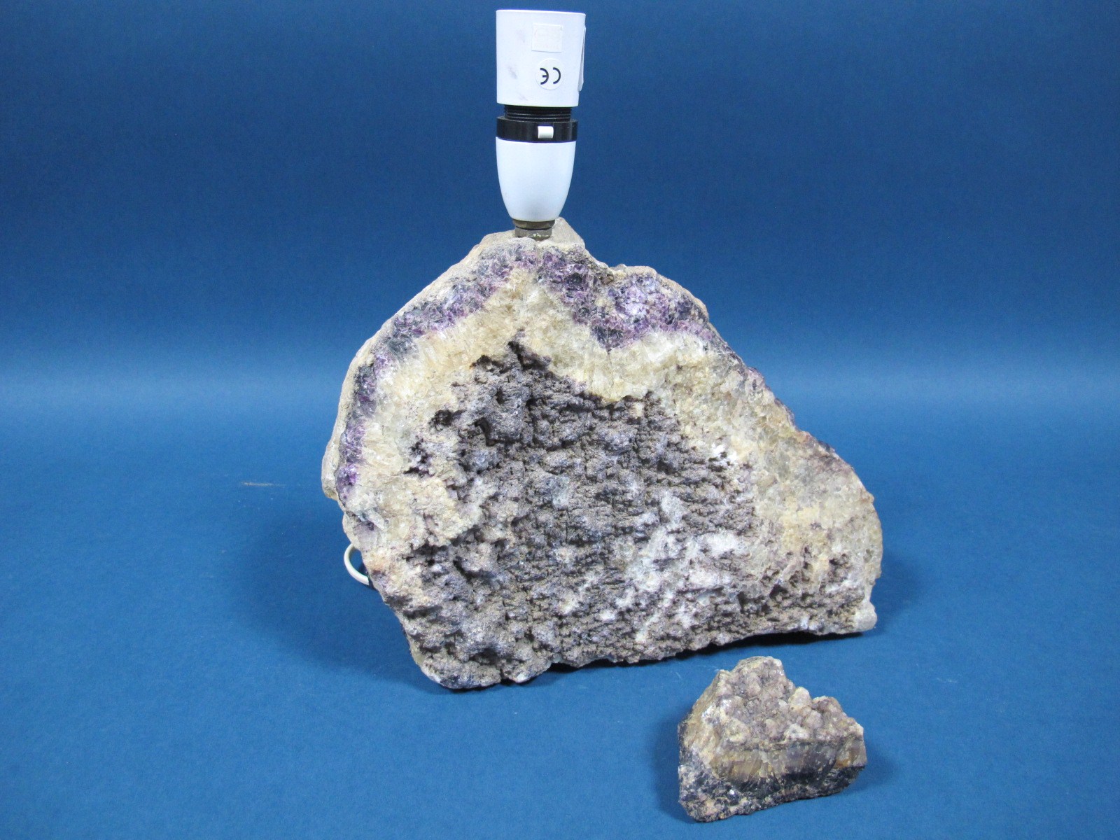 A Blue John Rock, of roughly semi-circular form, with typical purple vein throughout, converted to a