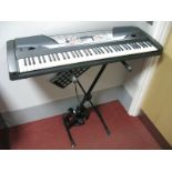 A Yamaha PSR-GX76 Electric Piano, with folding stand, music sheet rest, Sanyo and Sennheiser HD205