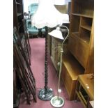An Oak Standard Lamp, barley twist column (with shade) and a brass effect standard lamp. (2)