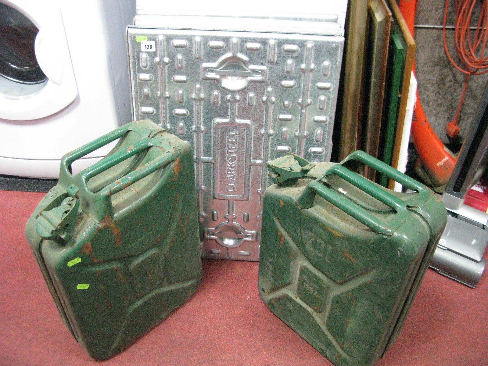 Two 20 Litre Petrol Cans, moulded '1987' (2), seven 'Clarksteel' drain covers. (9)