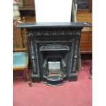 A Victorian Style Cast Iron Fire Surround, cast decoration with a frieze of foliate lunettes,