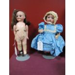 An Early XX Century Porcelain Headed Doll by Armand Marseille of Germany, sleepy eyes/ open mouth