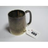 A Small Hallmarked Silver Mug, of plain tapering cylindrical form with elongated loop handle.