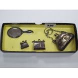 A Silver Backed Dolls House Hand Mirror, Birmingham 1912 (?) and three electroplated miniature