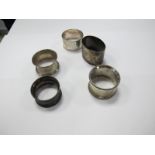 Five Hallmarked Silver Napkin Rings, varying designs.