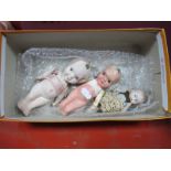 Three Early XX Century Bisque Kewpie Dolls, with moving arms, 11 - 16cms.