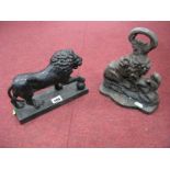 XIX Century Cast Iron Doorstop of Lion and a Snake, together with a XIX Century cast iron door