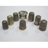 A Collection of Assorted Thimbles, together with a small pot with pull off cover. (8)