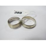 Two 9ct White Gold Bands, one with patterned detail. (2)