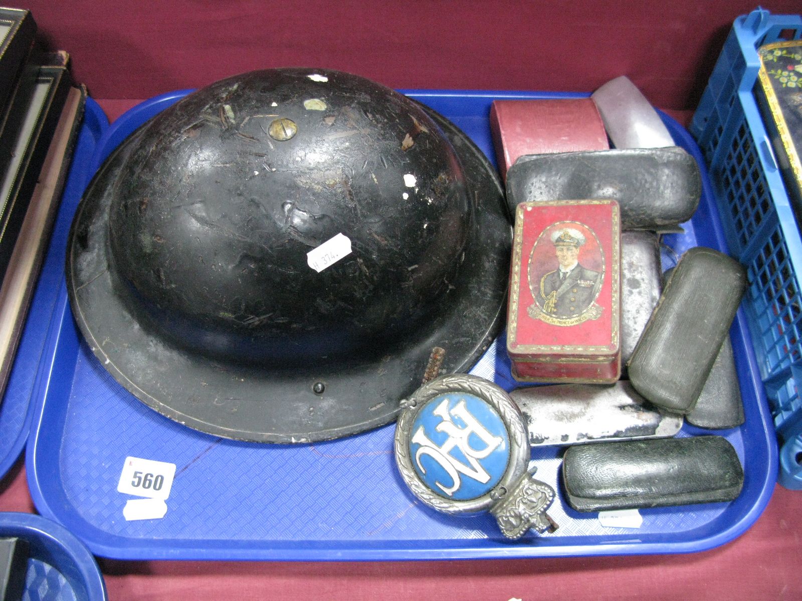 Early XX Century Rimmed Spectacles, R.A.C. Badge, WWII Air Raid Helmet:- One Tray