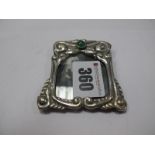 An Arts & Crafts Miniature Photograph Frame, circular cabochon set, stamped "830S" and "Chr.J" for