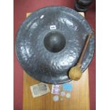 A Hammered Copper Gong, 45 cms diameter, with hammer, together with pre decimal coinage including