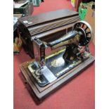 Singer Sewing Machine, in dome case.