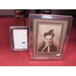 A Hallmarked Silver Mounted Rectangular Photograph Frame, on wooden easel back, 26.7cms high;