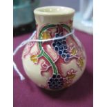 A Moorcroft Pottery Miniature Baluster Vase, decorated with the Corinth Grapes design from the