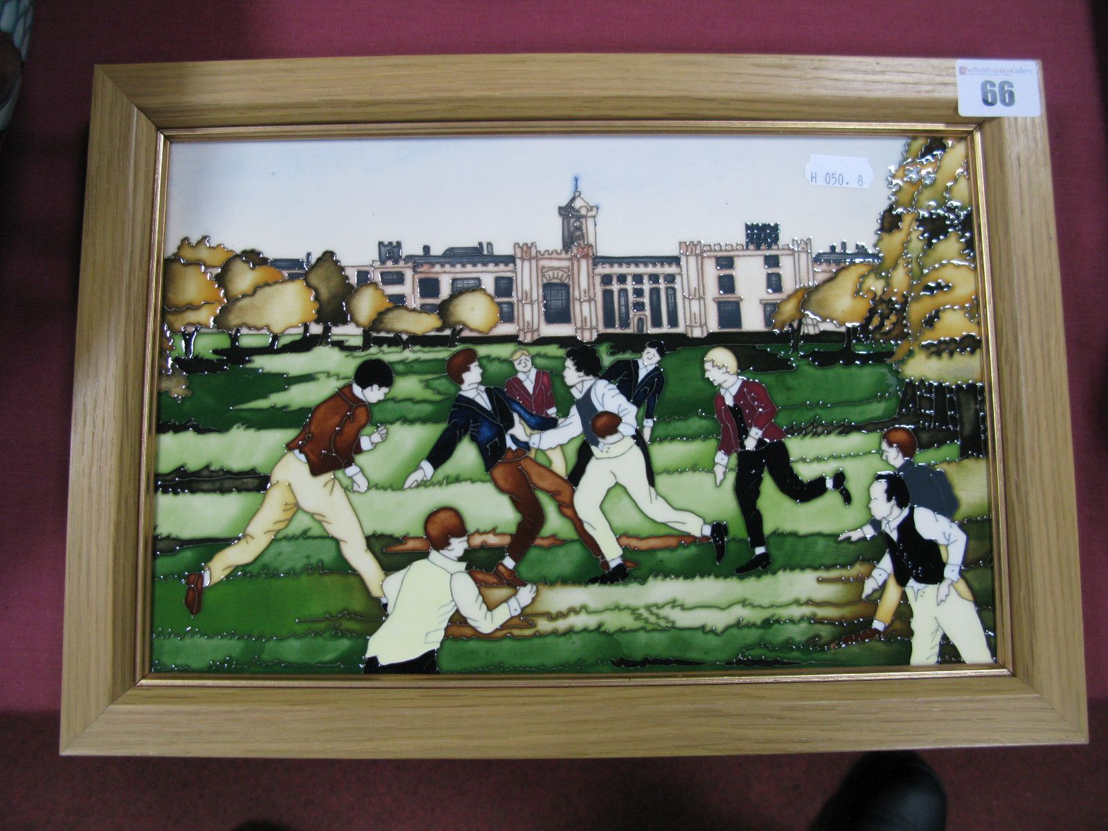 A Moorcroft Pottery Plaque, decorated with the Birth of Rugby design by Paul Hilditch, numbered